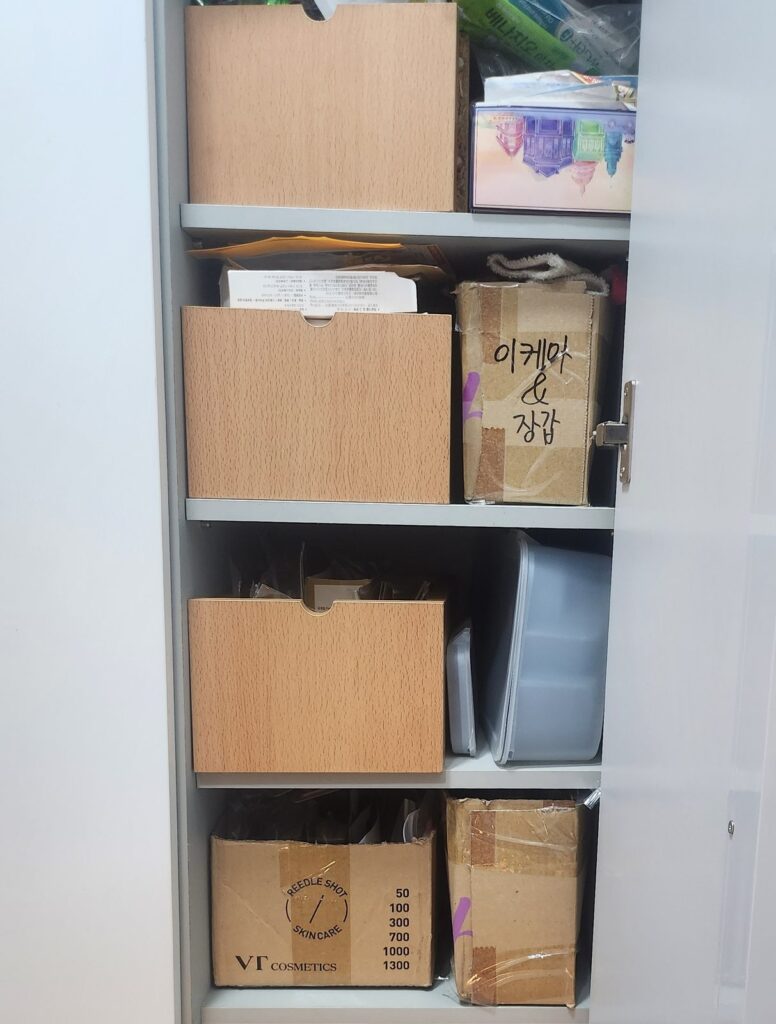 Recycled boxes used as labeled drawers to clear an ADHD doom pile