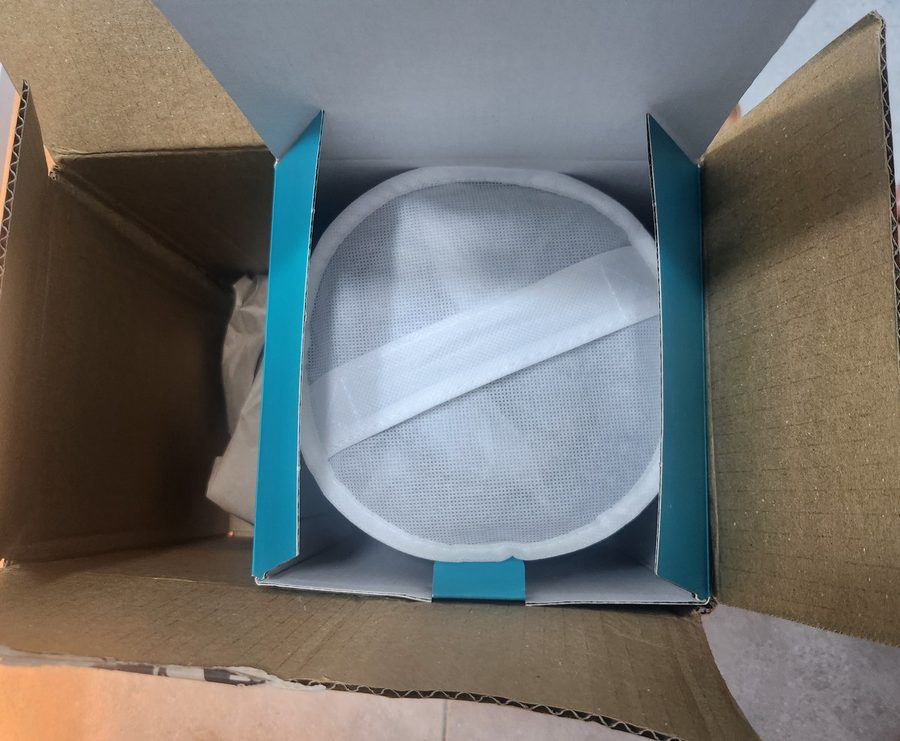 unboxing my weighted blanket, the newest of my ADHD sleep products, folded inside its white carry case